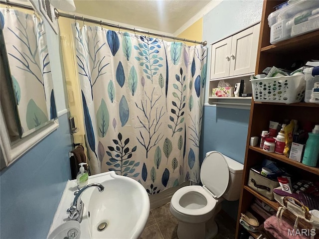 1714 Price St, Hannibal, MO 63401 - full bathroom with toilet, a sink, tile patterned flooring, and curtained shower