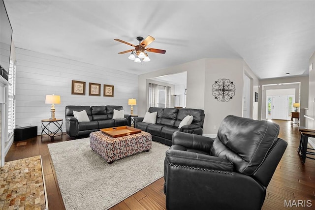 515 Country Chase Dr, Lake St Louis, MO 63367 - living room featuring ceiling fan, baseboards, hardwood / wood-style floors, a fireplace with flush hearth, and wood walls