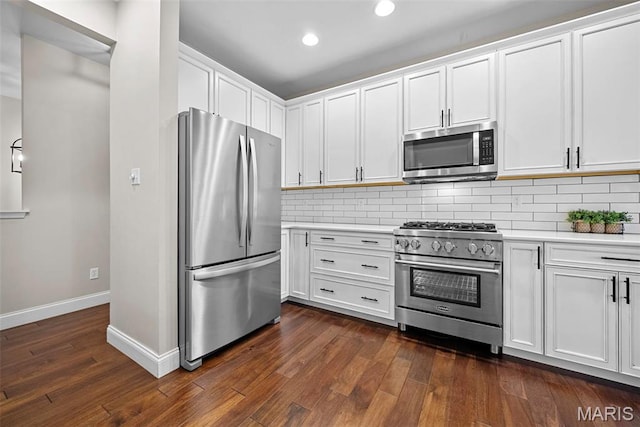 515 Country Chase Dr, Lake St Louis, MO 63367 - kitchen with stainless steel appliances, light countertops, decorative backsplash, dark wood-style floors, and recessed lighting