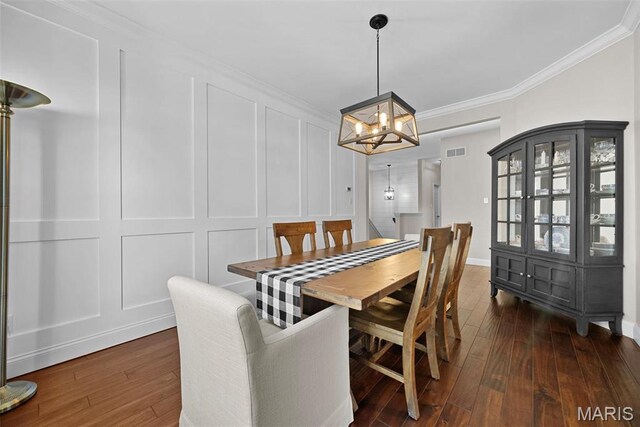 515 Country Chase Dr, Lake St Louis, MO 63367 - dining space with a decorative wall, dark wood-style flooring, crown molding, a chandelier, and baseboards