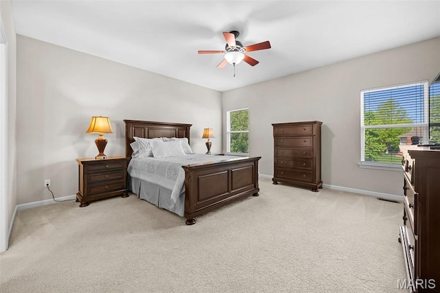 515 Country Chase Dr, Lake St Louis, MO 63367 - bedroom with multiple windows, baseboards, and light carpet