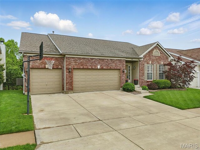 515 Country Chase Dr, Lake St Louis, MO 63367 - view of front of home with brick siding, roof with shingles, a front lawn, and a garage