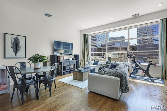 8025 Maryland Ave Unit 2H, Saint Louis, MO 63105 - living area with wood finished floors and recessed lighting