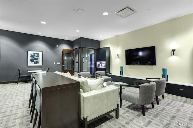 8025 Maryland Ave Unit 2H, Saint Louis, MO 63105 - living room featuring light colored carpet, recessed lighting, and baseboards