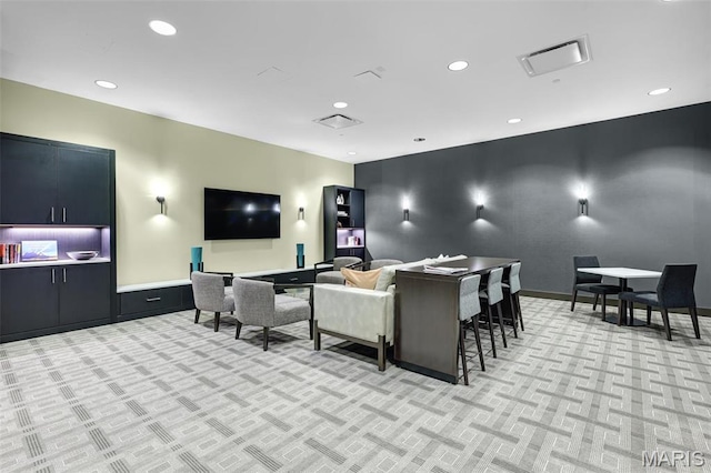 8025 Maryland Ave Unit 2H, Saint Louis, MO 63105 - living room featuring light colored carpet and recessed lighting