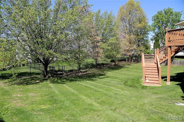 view of yard featuring stairway and a wooden deck