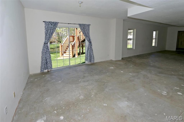 spare room with concrete flooring