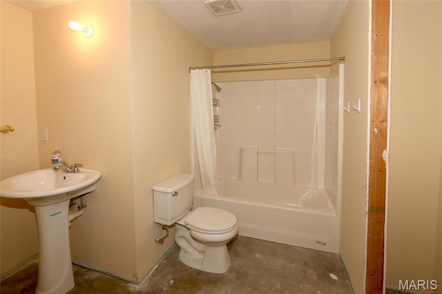 full bath with unfinished concrete flooring, toilet, shower / bath combo, and a sink