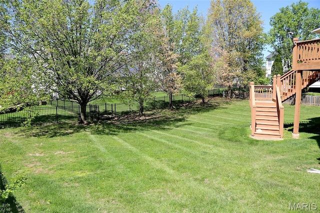 view of yard with stairway and a wooden deck