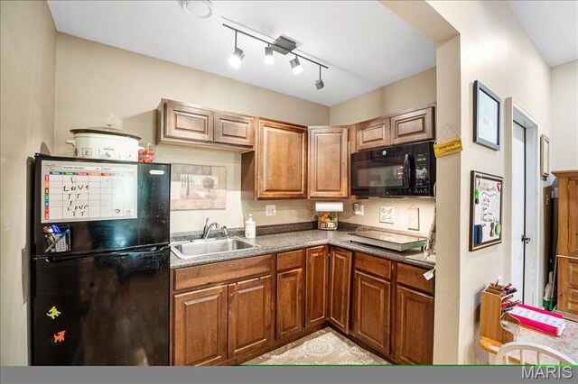 1909 Shepard Rd, Wildwood, MO 63038 - kitchen with black appliances, a sink, brown cabinets, and rail lighting