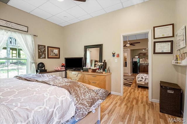 1909 Shepard Rd, Wildwood, MO 63038 - bedroom featuring light wood-style flooring, a drop ceiling, and baseboards