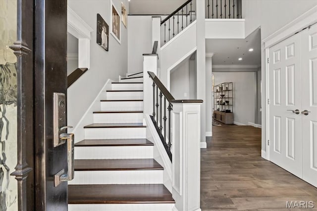 1909 Shepard Rd, Wildwood, MO 63038 - staircase with wood finished floors, ornamental molding, baseboards, recessed lighting, and a high ceiling