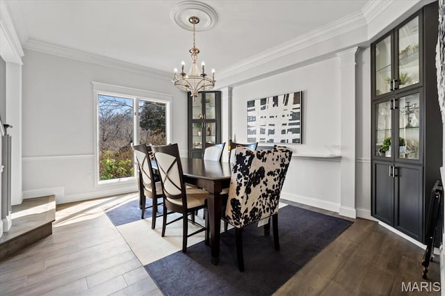 1909 Shepard Rd, Wildwood, MO 63038 - dining space featuring a chandelier, dark wood finished floors, ornamental molding, and baseboards