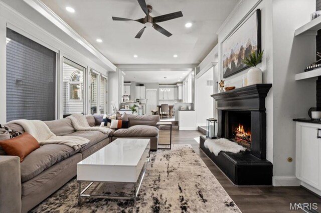 1909 Shepard Rd, Wildwood, MO 63038 - living area with ceiling fan, dark wood finished floors, recessed lighting, a lit fireplace, and baseboards