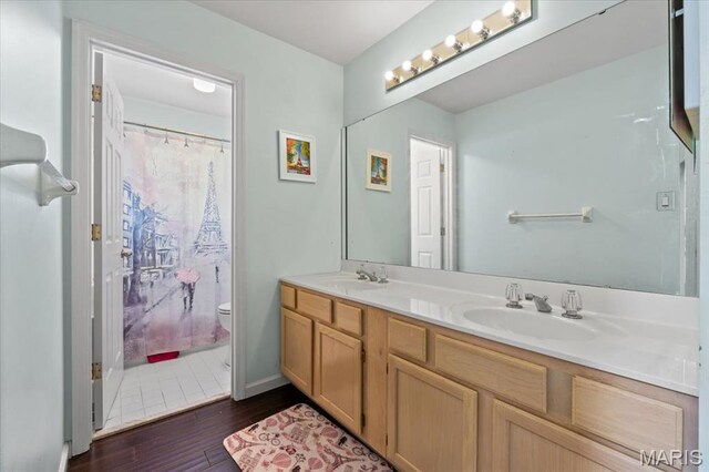 1909 Shepard Rd, Wildwood, MO 63038 - full bathroom with wood finished floors, double vanity, toilet, curtained shower, and baseboards