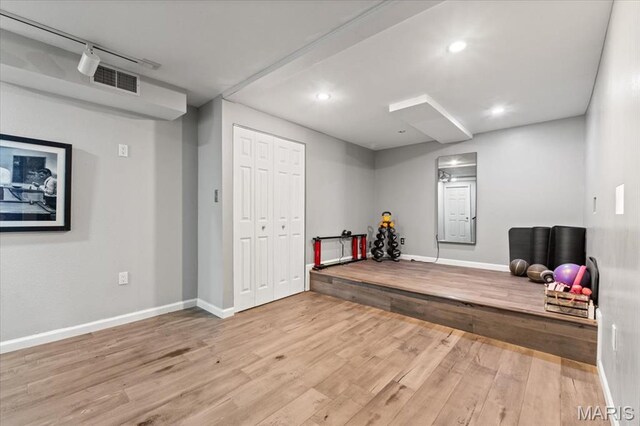 1909 Shepard Rd, Wildwood, MO 63038 - workout room featuring wood finished floors, baseboards, and recessed lighting