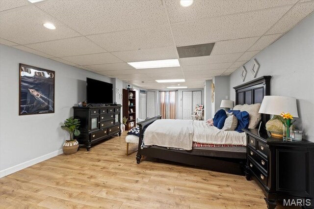 1909 Shepard Rd, Wildwood, MO 63038 - bedroom with baseboards, light wood-style floors, and a paneled ceiling