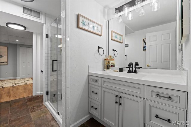 1909 Shepard Rd, Wildwood, MO 63038 - full bathroom featuring a stall shower, baseboards, vanity, and stone finish flooring