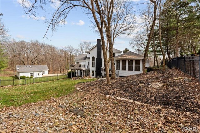 1909 Shepard Rd, Wildwood, MO 63038 - rear view of property with a chimney, a sunroom, and a wooden deck