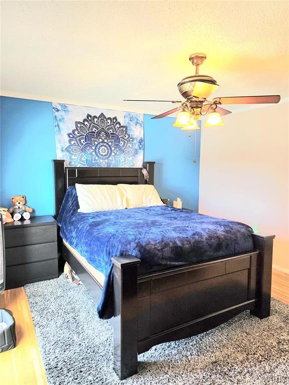 10340 Corbeil Dr, Saint Louis, MO 63146 - bedroom featuring wood finished floors and ceiling fan