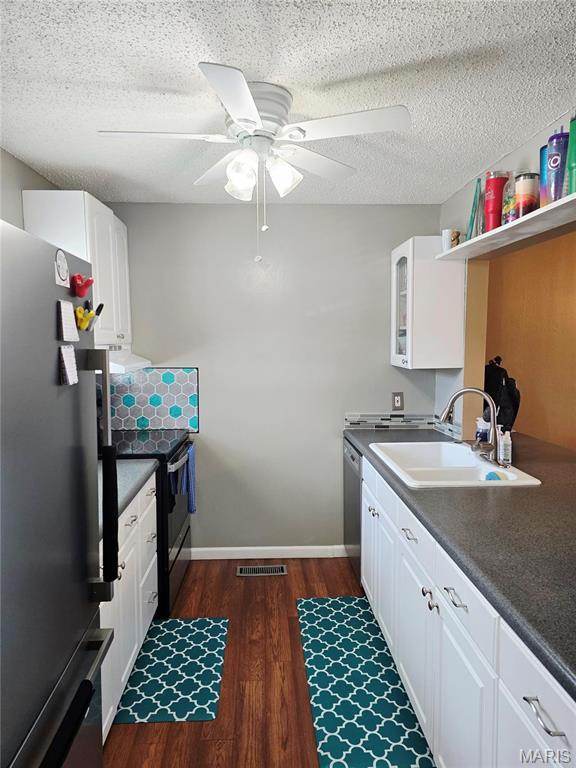 10340 Corbeil Dr, Saint Louis, MO 63146 - kitchen featuring freestanding refrigerator, a sink, black range with electric stovetop, stainless steel dishwasher, and dark wood-style flooring