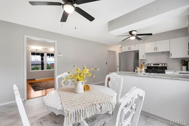 133 Winthrop Dr, Belleville, IL 62221 - dining space with a ceiling fan and baseboards