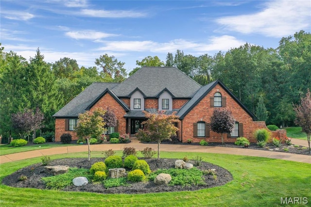 13552 Weston Park Dr, Saint Louis, MO 63131 - view of front of property with a front lawn, brick siding, and curved driveway