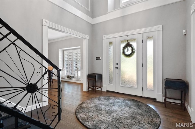 13552 Weston Park Dr, Saint Louis, MO 63131 - foyer featuring wood finished floors, ornamental molding, stairway, baseboards, and a high ceiling