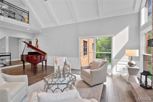 13552 Weston Park Dr, Saint Louis, MO 63131 - living room with high vaulted ceiling, beamed ceiling, wood finished floors, healthy amount of natural light, and a decorative wall