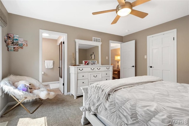 13552 Weston Park Dr, Saint Louis, MO 63131 - bedroom with light colored carpet, baseboards, ensuite bathroom, and a ceiling fan