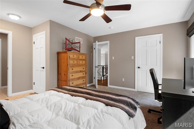 13552 Weston Park Dr, Saint Louis, MO 63131 - carpeted bedroom with baseboards, a desk, and a ceiling fan