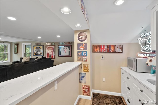 13552 Weston Park Dr, Saint Louis, MO 63131 - bar area featuring white microwave, baseboards, recessed lighting, and light wood finished floors