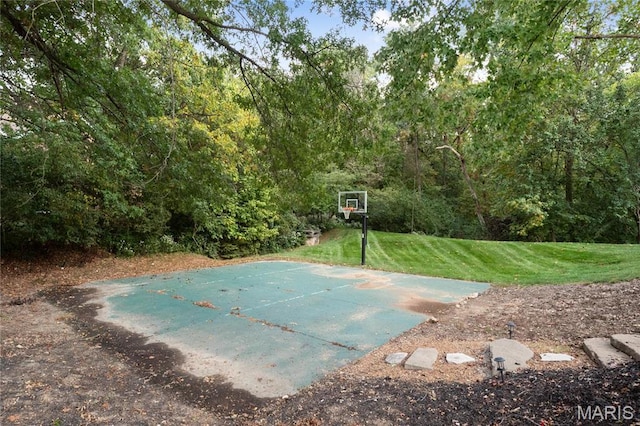 13552 Weston Park Dr, Saint Louis, MO 63131 - view of basketball court with a yard and basketball hoop
