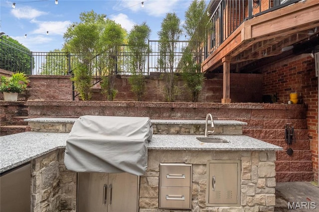 13552 Weston Park Dr, Saint Louis, MO 63131 - view of patio with a sink, fence, exterior kitchen, and area for grilling