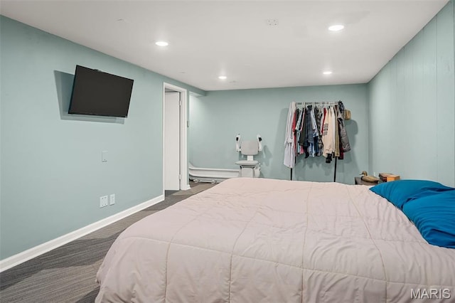 bedroom with recessed lighting, baseboards, and dark carpet