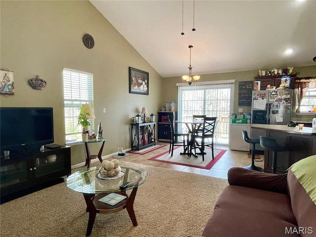 22880 Return Ln, Waynesville, MO 65583 - living area with a chandelier, light tile patterned flooring, high vaulted ceiling, and baseboards