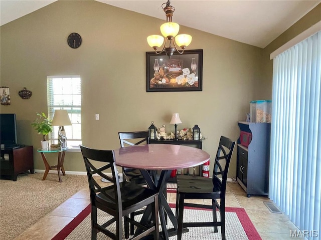 22880 Return Ln, Waynesville, MO 65583 - dining space featuring lofted ceiling, light tile patterned floors, a chandelier, and baseboards