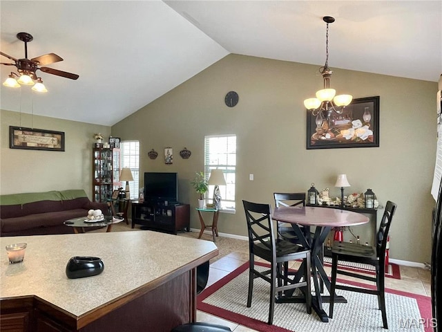 22880 Return Ln, Waynesville, MO 65583 - dining area featuring vaulted ceiling, ceiling fan, light tile patterned floors, and baseboards