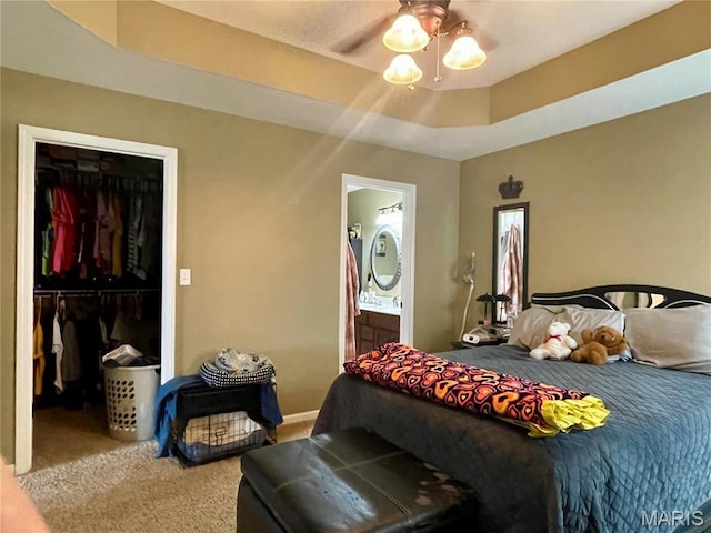 22880 Return Ln, Waynesville, MO 65583 - bedroom with carpet, a spacious closet, ensuite bathroom, a closet, and baseboards