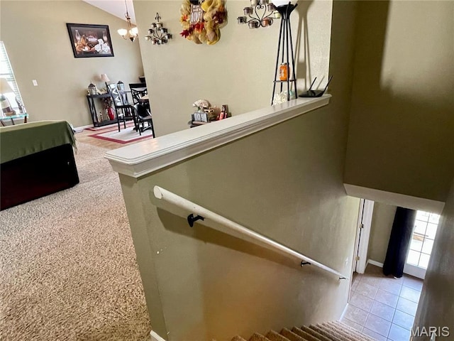 22880 Return Ln, Waynesville, MO 65583 - staircase with a chandelier, vaulted ceiling, and tile patterned flooring
