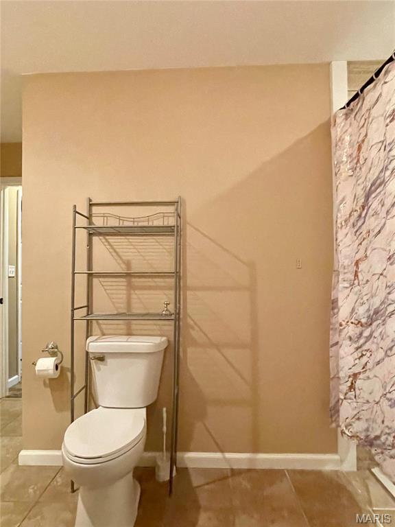 22880 Return Ln, Waynesville, MO 65583 - bathroom featuring toilet, tile patterned floors, and baseboards