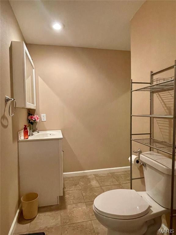22880 Return Ln, Waynesville, MO 65583 - bathroom featuring toilet, vanity, and baseboards
