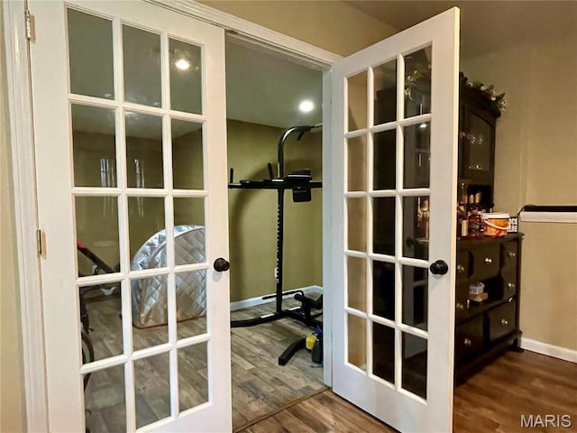 22880 Return Ln, Waynesville, MO 65583 - exercise area with french doors, wood finished floors, and baseboards