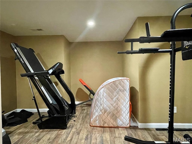 22880 Return Ln, Waynesville, MO 65583 - workout area with wood finished floors and baseboards