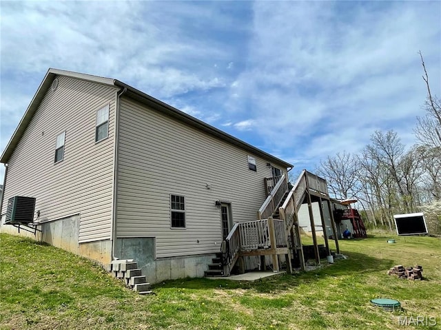 22880 Return Ln, Waynesville, MO 65583 - back of house with stairway, a yard, and a deck