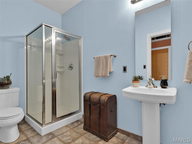 901 Washington Ave Unit 205, Saint Louis, MO 63101 - bathroom featuring a shower stall, toilet, and a sink