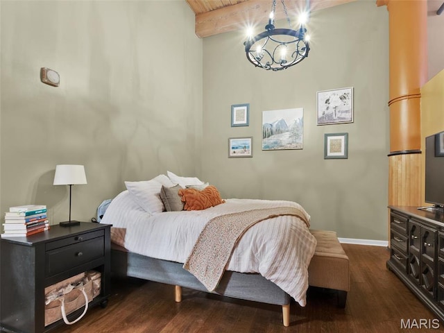 901 Washington Ave Unit 205, Saint Louis, MO 63101 - bedroom with a chandelier, dark wood-type flooring, beamed ceiling, and baseboards