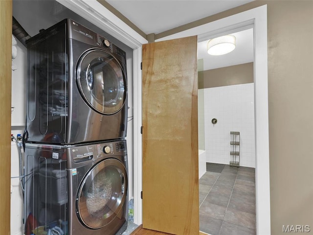 901 Washington Ave Unit 205, Saint Louis, MO 63101 - laundry area with estacked washer and dryer and tile patterned floors