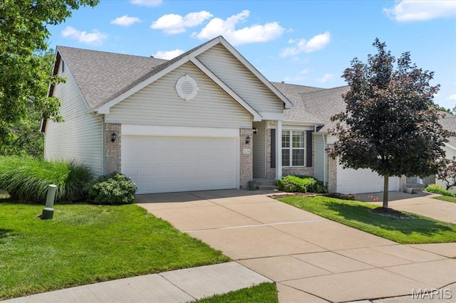 1136 Arbor Place Dr, Manchester, MO 63088 - view of front facade featuring a garage, driveway, a front lawn, and brick siding