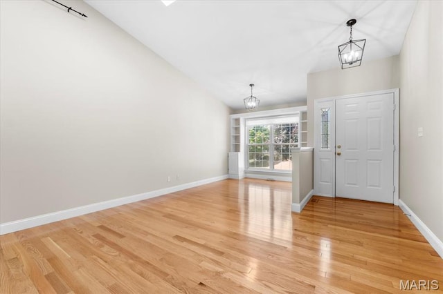 1136 Arbor Place Dr, Manchester, MO 63088 - entryway with a chandelier, light wood-type flooring, and lofted ceiling